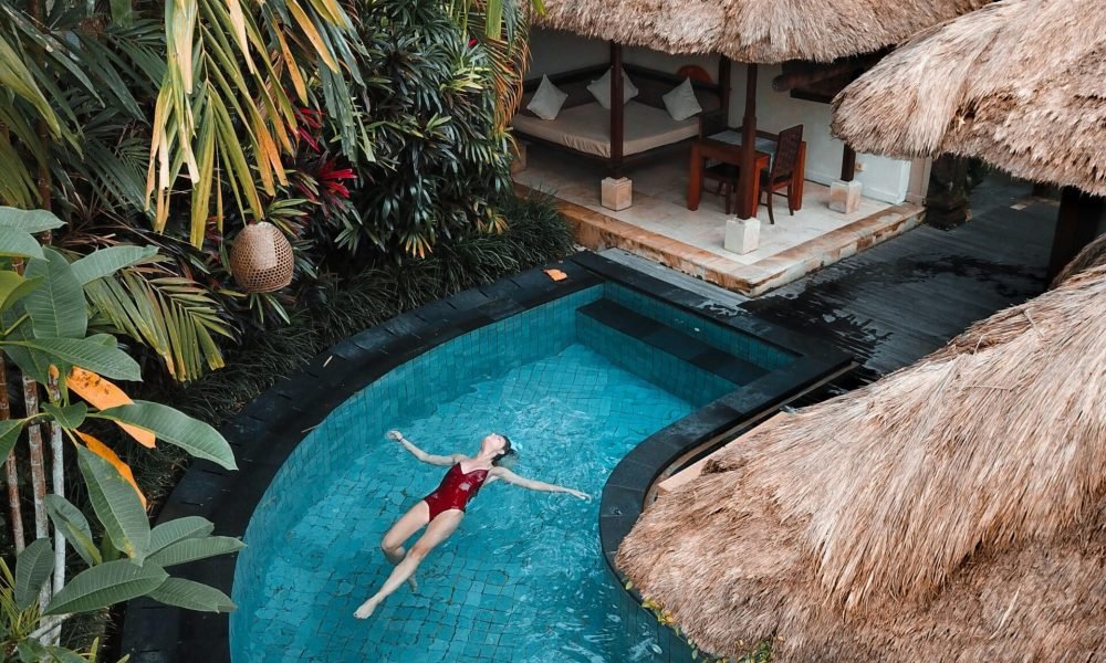 woman floating in the water in a tropical island