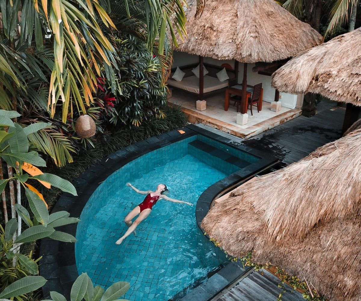 woman floating in the water in a tropical island